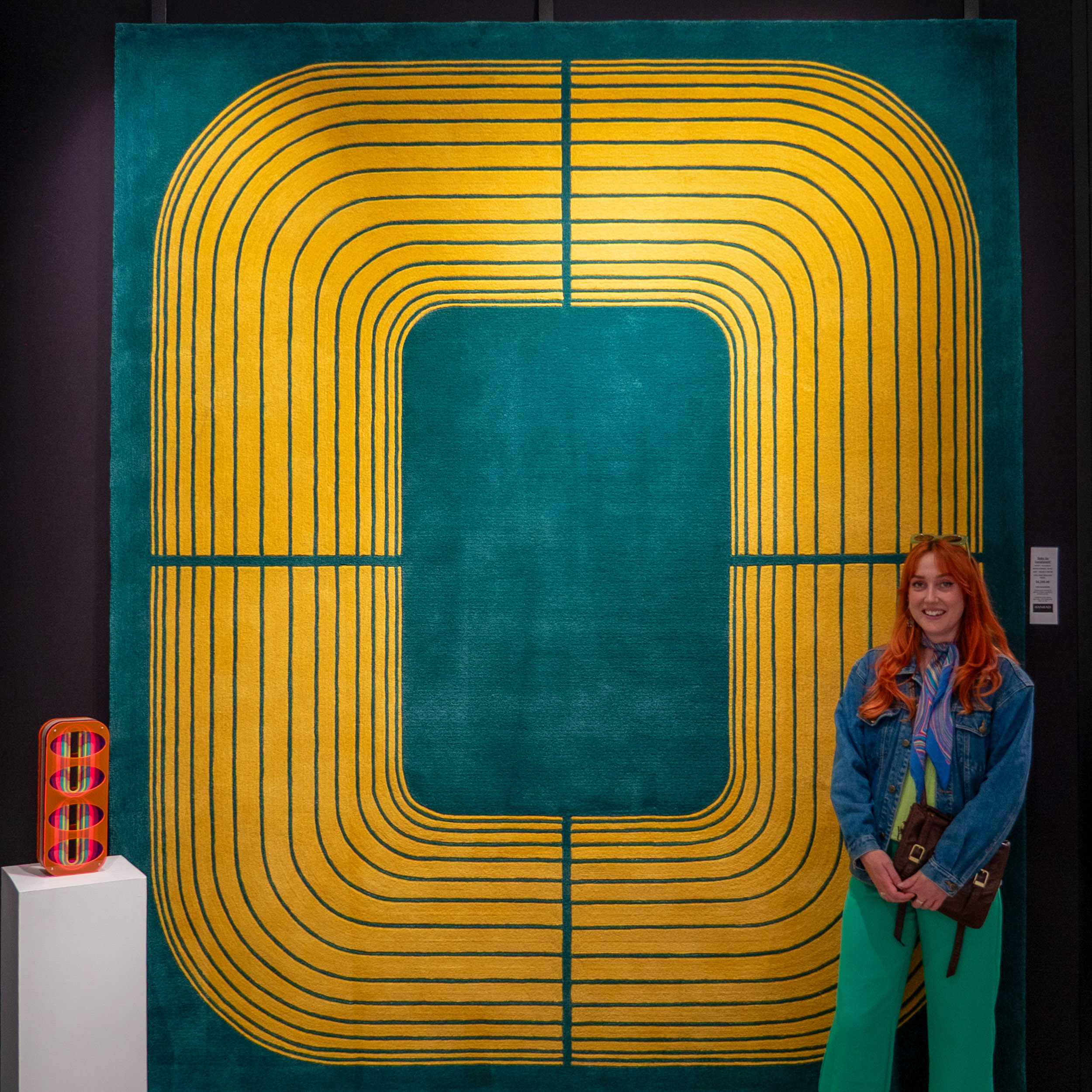 Kayla Bacon with her artwork on display at Hanrads