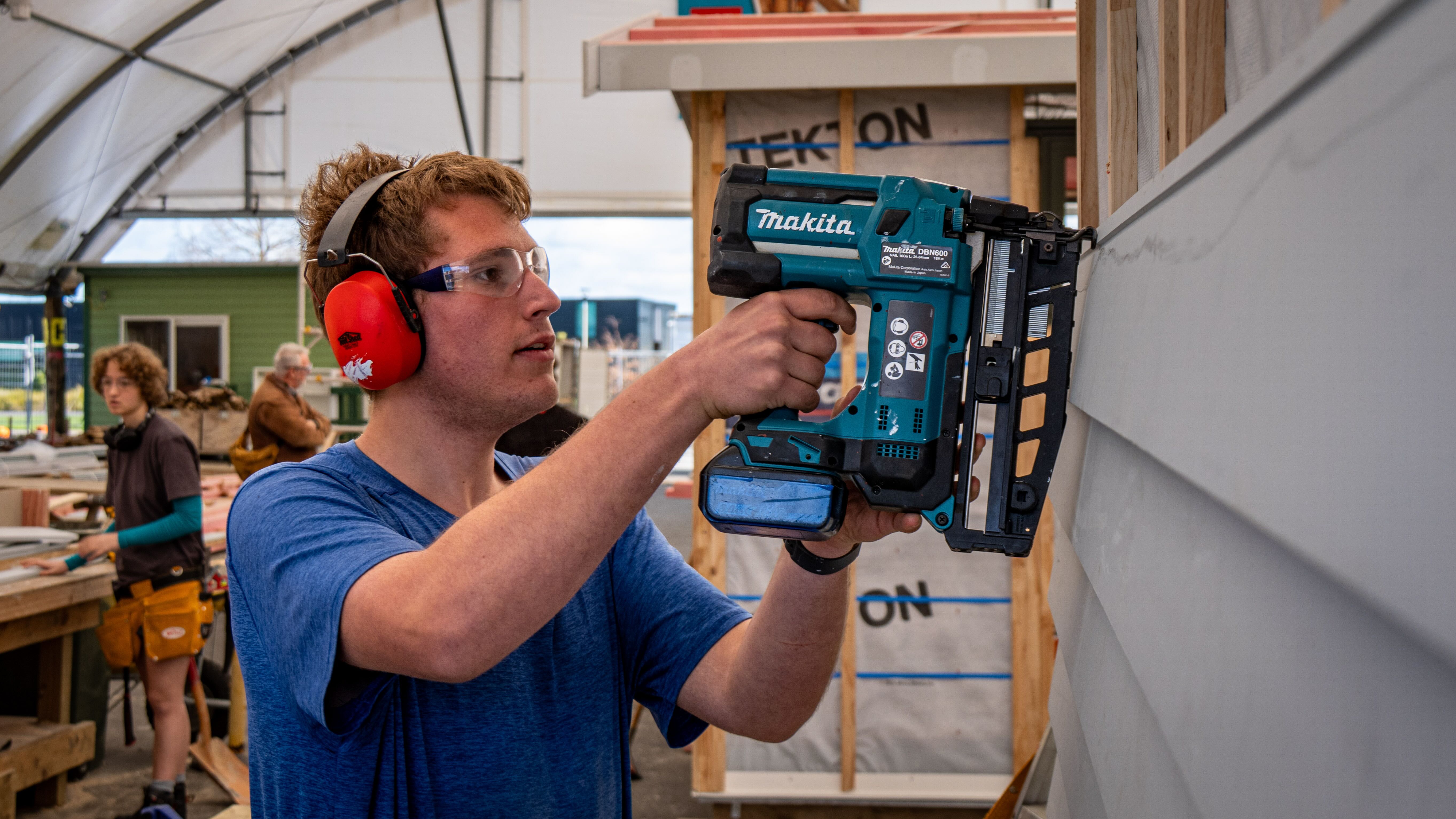 Student using Makita brad gun