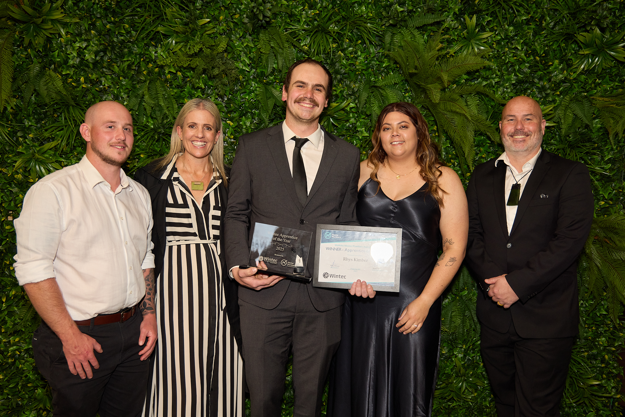 Rhys Kimber celebrates his award win with his partner and Soda Plumbing and Gas team.
